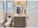 Stylish bathroom with patterned wallpaper, modern vanity, and shower-tub combination at 10119 Bellwether Ln, Lone Tree, CO 80124