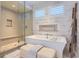 Relaxing bathroom featuring a standalone tub, walk-in shower, and stone floors at 10119 Bellwether Ln, Lone Tree, CO 80124