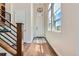 Bright foyer with hardwood floors, a staircase, a stylish light fixture, and ample natural light at 10119 Bellwether Ln, Lone Tree, CO 80124