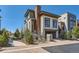 Modern two-story home featuring stone accents, wood siding, and a well-manicured front yard at 10119 Bellwether Ln, Lone Tree, CO 80124