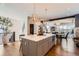 Spacious kitchen island with pendant lights, counter seating, and an open floor plan at 10119 Bellwether Ln, Lone Tree, CO 80124