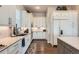 Bright kitchen with white cabinetry, modern appliances, and a stylish backsplash at 10119 Bellwether Ln, Lone Tree, CO 80124