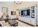 Spacious living room with built-in shelving and cabinetry, perfect for displaying decor and media at 10119 Bellwether Ln, Lone Tree, CO 80124