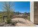 Landscaped patio space offers a serene outdoor escape, complemented by neighborhood views and manicured greenery at 10119 Bellwether Ln, Lone Tree, CO 80124