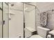Bright shower with white subway tile and a glass door, complemented by geometric wallpaper at 10119 Bellwether Ln, Lone Tree, CO 80124