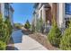 Exterior sidewalk view showcasing the architecture, landscaping, and inviting entrance, enhancing the property's curb appeal at 10119 Bellwether Ln, Lone Tree, CO 80124