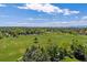 Expansive green space featuring sports fields, lush trees, and clear skies at 7589 S Cove Cir, Centennial, CO 80122