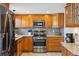 Well-equipped kitchen featuring stainless steel appliances and granite countertops at 7589 S Cove Cir, Centennial, CO 80122