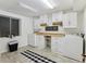 Laundry room with white cabinets, countertops, washer and dryer with natural light at 7589 S Cove Cir, Centennial, CO 80122