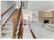 Inviting living room showcasing a staircase, fireplace, and elegant hardwood flooring at 7589 S Cove Cir, Centennial, CO 80122