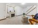 Cozy living room with fireplace, window with blinds, and comfortable seating area at 7589 S Cove Cir, Centennial, CO 80122