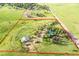 Expansive land featuring a lush, green setting with mature trees and custom built motocross track at 1353 S Elbert St, Elizabeth, CO 80107
