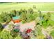 Aerial view of home with a pool, barns, and vehicle parking on large acreage at 1353 S Elbert St, Elizabeth, CO 80107