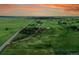 Extensive grassy land with a cozy home, outbuilding, and custom built motocross track; quiet countryside living at 1353 S Elbert St, Elizabeth, CO 80107