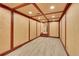 Finished basement with a tiled floor, wood trim, and recessed lighting at 1353 S Elbert St, Elizabeth, CO 80107