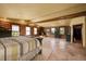 Spacious bedroom features log walls, a wood burning stove, and a private ensuite at 1353 S Elbert St, Elizabeth, CO 80107