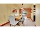 Elegant dining room with a wooden table, upholstered chairs, and stylish mirror accenting the space at 1353 S Elbert St, Elizabeth, CO 80107