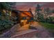 Log cabin home with a covered deck, stone stairs, and landscaped surroundings at 1353 S Elbert St, Elizabeth, CO 80107