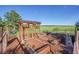 Outdoor vegetable garden with raised beds, decorative pergola, and scenic views at 1353 S Elbert St, Elizabeth, CO 80107