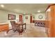 Spacious office with a wooden desk, tile floors, and ample storage at 1353 S Elbert St, Elizabeth, CO 80107