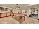 Basement pool table and wet bar area with stainless steel appliances at 1353 S Elbert St, Elizabeth, CO 80107
