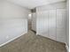 Bedroom features neutral colored walls, carpet, and a closet at 3957 S Boston St, Denver, CO 80237