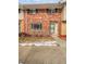 Charming brick townhome featuring a well-maintained exterior and inviting entrance at 3957 S Boston St, Denver, CO 80237