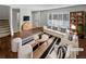 Bright, staged living room featuring a large window, comfortable seating, and modern decor at 3957 S Boston St, Denver, CO 80237