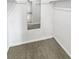 Empty walk-in closet with a wall mirror features neutral carpet and white walls at 3957 S Boston St, Denver, CO 80237