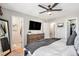Relaxing bedroom with a plush bed, a flat-screen TV, and easy access to the ensuite bathroom and walk-in closet at 2488 W 111Th Pl, Denver, CO 80234