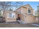 Charming two-story home with a well-manicured front yard, two-car garage, and inviting entryway at 2488 W 111Th Pl, Denver, CO 80234