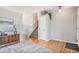 Welcoming foyer with hardwood floors, a staircase, and stylish decor, creating an inviting entrance to the home at 2488 W 111Th Pl, Denver, CO 80234
