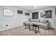 Comfortable living room features a plush sofa, a sleek coffee table, and tasteful decor for a cozy atmosphere at 2488 W 111Th Pl, Denver, CO 80234