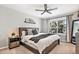 Relaxing bedroom with a queen-size bed, soft lighting, and a large window overlooking the outdoors at 2488 W 111Th Pl, Denver, CO 80234
