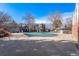 Spacious community pool, covered for the season, surrounded by well-maintained grounds and townhomes at 2488 W 111Th Pl, Denver, CO 80234