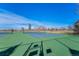 Well-maintained tennis courts with a green and blue surface and a surrounding fence at 2488 W 111Th Pl, Denver, CO 80234