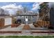 Spacious backyard featuring a dining space and garden beds, perfect for outdoor living at 1445 Ash St, Denver, CO 80220
