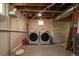 Basement laundry area featuring updated washer and dryer units at 1445 Ash St, Denver, CO 80220
