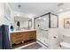 Elegant bathroom features a double vanity with modern fixtures and a glass-enclosed shower at 1445 Ash St, Denver, CO 80220