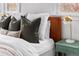 Bedroom close up showcasing plush pillows, a side table with lamp, and natural light at 1445 Ash St, Denver, CO 80220