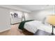 Cozy bedroom features a comfortable bed, white dresser and mirror at 1445 Ash St, Denver, CO 80220