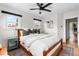Cozy bedroom with a ceiling fan, natural light from the windows, and a well-placed side table at 1445 Ash St, Denver, CO 80220