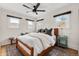 Comfortable bedroom with a cozy rug, ceiling fan, and natural light from two well-placed windows at 1445 Ash St, Denver, CO 80220
