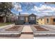 Charming home featuring a well-maintained front yard with tasteful landscaping at 1445 Ash St, Denver, CO 80220
