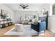 Inviting living room with neutral tones, a cozy seating area, and a stylish fireplace at 1445 Ash St, Denver, CO 80220