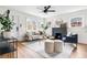 Bright living room with hardwood floors, fireplace, and lots of seating at 1445 Ash St, Denver, CO 80220