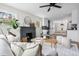 Cozy living room and kitchen, with a fireplace, modern decor, and an open layout at 1445 Ash St, Denver, CO 80220