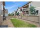 View of the backyard featuring lawn, privacy fence, pea gravel and surrounding houses at 3336 Goodyear St, Castle Rock, CO 80109