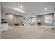 Spacious basement with neutral carpet, recessed lighting, and bar area—ideal for entertaining and relaxation at 3336 Goodyear St, Castle Rock, CO 80109