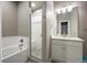 Modern bathroom featuring a tiled shower with a glass door, a soaking tub, and an elegant vanity area at 3336 Goodyear St, Castle Rock, CO 80109